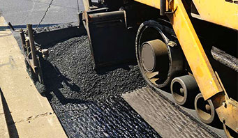 asphalt material with a backhoe