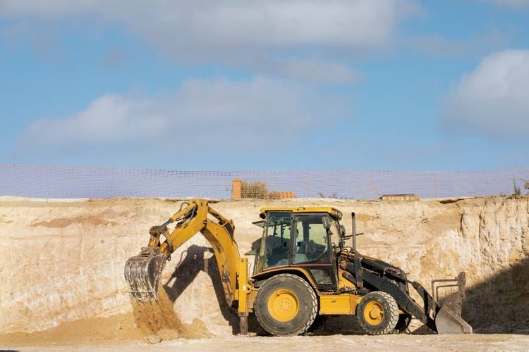 Heavy construction equipment supporting commercial development project in Elkhart, Indiana