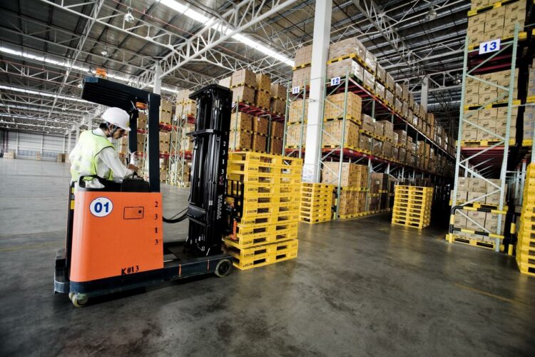 A forklift truck in a warehouse.
