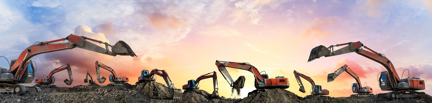 Multiple earthmoving equipment working on a construction site