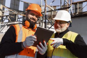 Construction contractors using National Dispatching’s Corporate Portal on-site via tablet