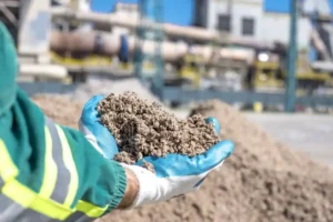 Worker inspecting construction material sample