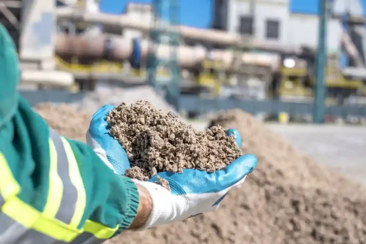 Worker inspecting construction material sample