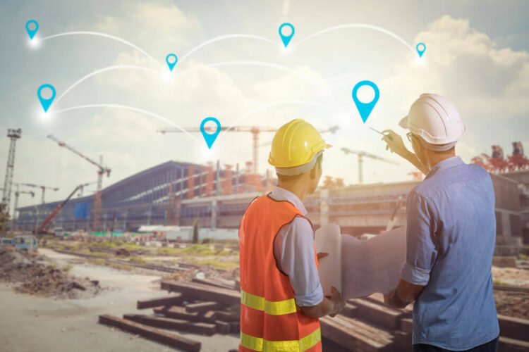 Construction managers reviewing site plans at an infrastructure project with connected location pins representing a nationwide procurement network.
